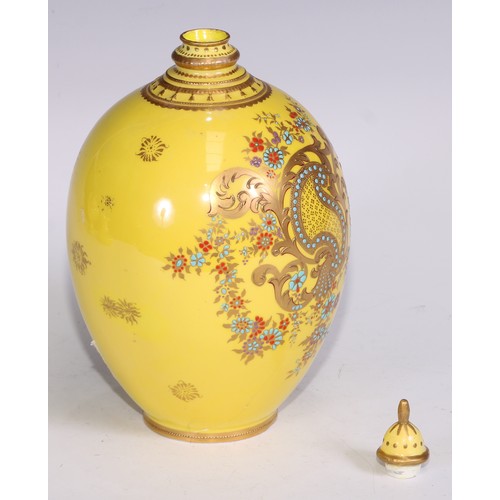 656 - A Royal Crown Derby two-handled boat shaped pedestal vase, moulded and decorated in gilt on a yellow... 