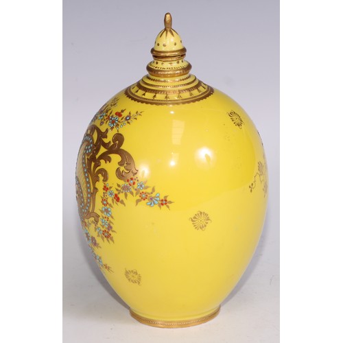 656 - A Royal Crown Derby two-handled boat shaped pedestal vase, moulded and decorated in gilt on a yellow... 