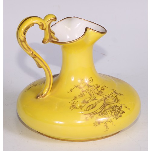 656 - A Royal Crown Derby two-handled boat shaped pedestal vase, moulded and decorated in gilt on a yellow... 