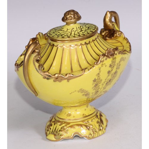 656 - A Royal Crown Derby two-handled boat shaped pedestal vase, moulded and decorated in gilt on a yellow... 