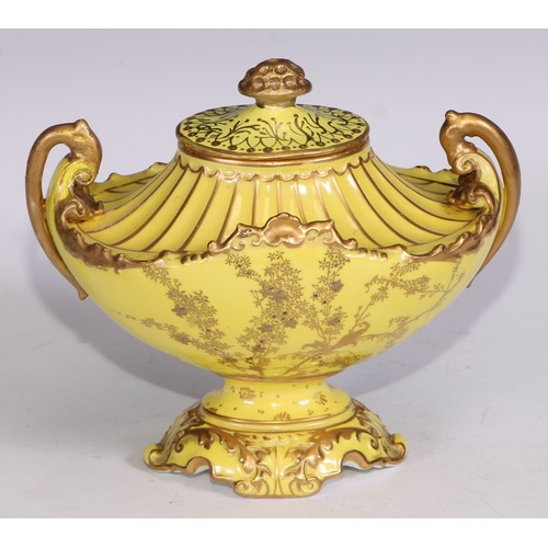 656 - A Royal Crown Derby two-handled boat shaped pedestal vase, moulded and decorated in gilt on a yellow... 