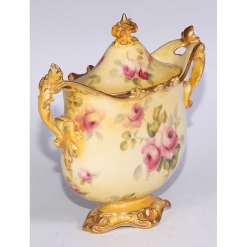 659 - A Royal Crown Derby two-handled vase, decorated with roses on a blush ground, 16.5cm wide, printed m... 