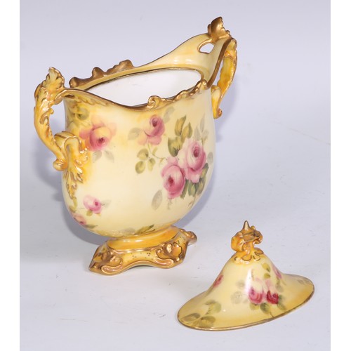 659 - A Royal Crown Derby two-handled vase, decorated with roses on a blush ground, 16.5cm wide, printed m... 