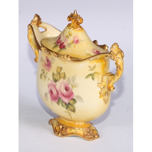 659 - A Royal Crown Derby two-handled vase, decorated with roses on a blush ground, 16.5cm wide, printed m... 