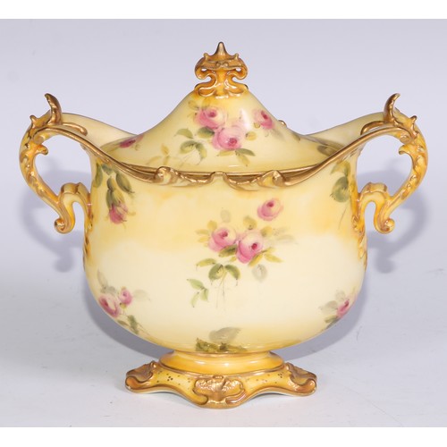 659 - A Royal Crown Derby two-handled vase, decorated with roses on a blush ground, 16.5cm wide, printed m... 