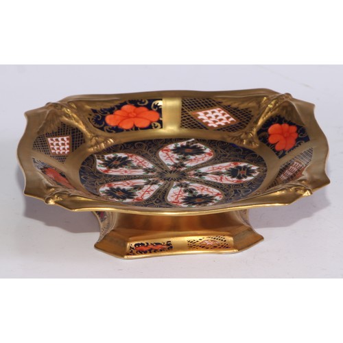 602 - A pair of Royal Crown Derby 1128 pattern shaped square pedestal comports, solid gold bands, 14cm wid... 