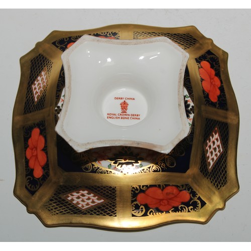 602 - A pair of Royal Crown Derby 1128 pattern shaped square pedestal comports, solid gold bands, 14cm wid... 