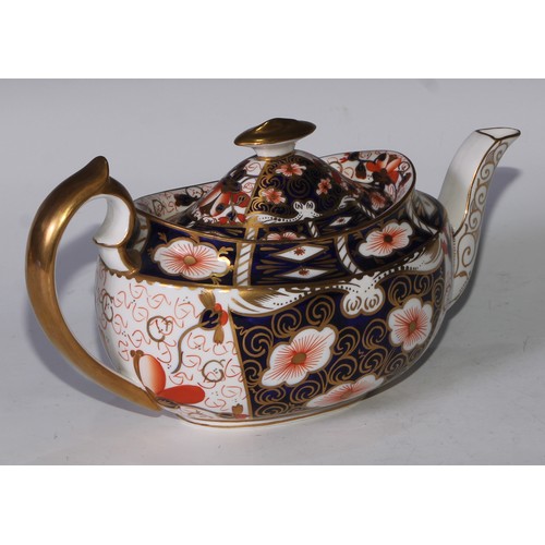 619 - A Royal Crown Derby 2451 pattern three piece tea service, comprising teapot, milk jug and sucrier, t... 