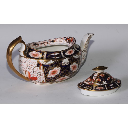 619 - A Royal Crown Derby 2451 pattern three piece tea service, comprising teapot, milk jug and sucrier, t... 