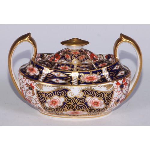 619 - A Royal Crown Derby 2451 pattern three piece tea service, comprising teapot, milk jug and sucrier, t... 