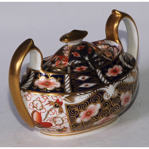 619 - A Royal Crown Derby 2451 pattern three piece tea service, comprising teapot, milk jug and sucrier, t... 