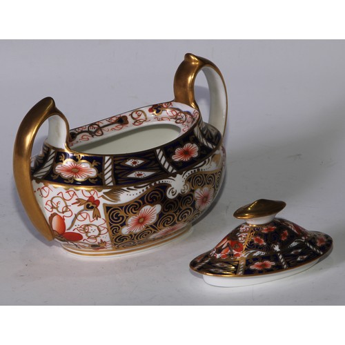 619 - A Royal Crown Derby 2451 pattern three piece tea service, comprising teapot, milk jug and sucrier, t... 