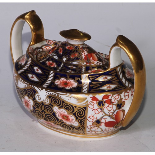 619 - A Royal Crown Derby 2451 pattern three piece tea service, comprising teapot, milk jug and sucrier, t... 