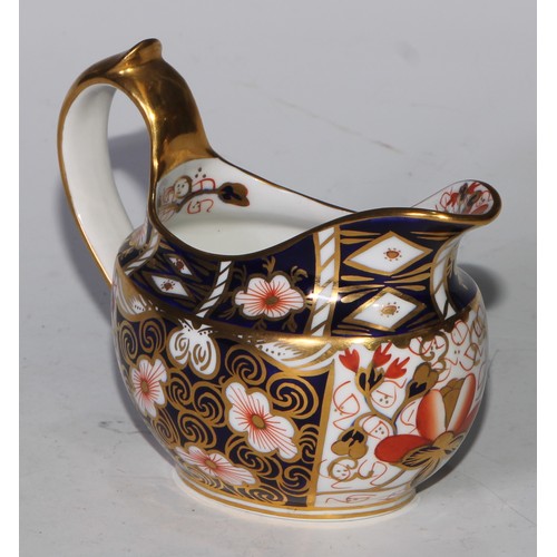 619 - A Royal Crown Derby 2451 pattern three piece tea service, comprising teapot, milk jug and sucrier, t... 