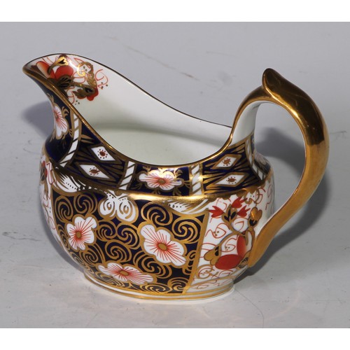 619 - A Royal Crown Derby 2451 pattern three piece tea service, comprising teapot, milk jug and sucrier, t... 