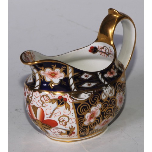 619 - A Royal Crown Derby 2451 pattern three piece tea service, comprising teapot, milk jug and sucrier, t... 