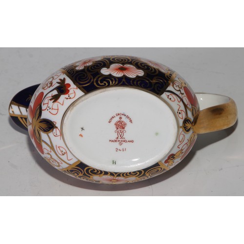 619 - A Royal Crown Derby 2451 pattern three piece tea service, comprising teapot, milk jug and sucrier, t... 