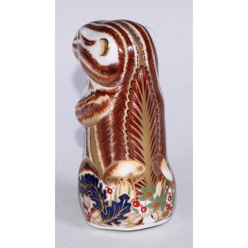 771 - A Royal Crown Derby paperweight, Starlight Hare, printed mark, gold stopper; others, Polar Bear; Bad... 