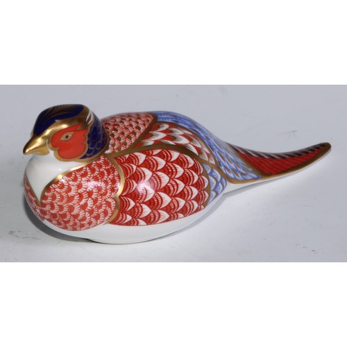 770 - A Royal Crown Derby paperweight, Pheasant, gold stopper; another, similar, no stopper; a Royal Crown... 