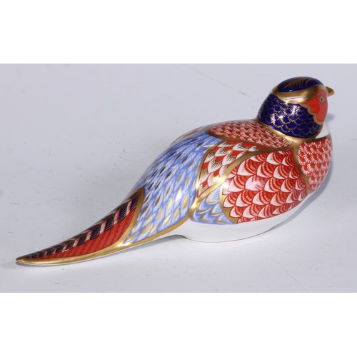 770 - A Royal Crown Derby paperweight, Pheasant, gold stopper; another, similar, no stopper; a Royal Crown... 