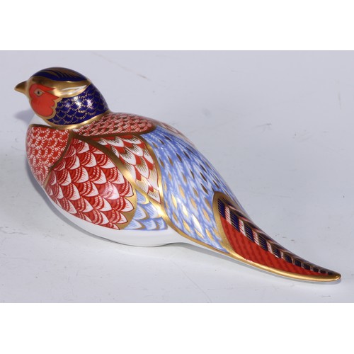 770 - A Royal Crown Derby paperweight, Pheasant, gold stopper; another, similar, no stopper; a Royal Crown... 