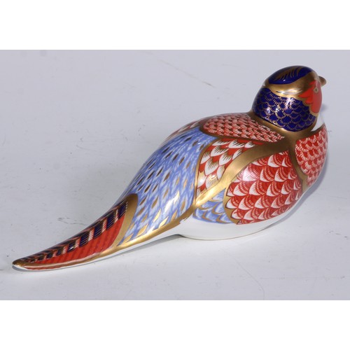 770 - A Royal Crown Derby paperweight, Pheasant, gold stopper; another, similar, no stopper; a Royal Crown... 