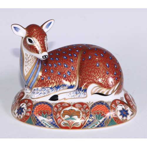 766 - A Royal Crown Derby Collectors Guild Exclusive paperweight, Deer, gold stopper; another similar, Faw... 