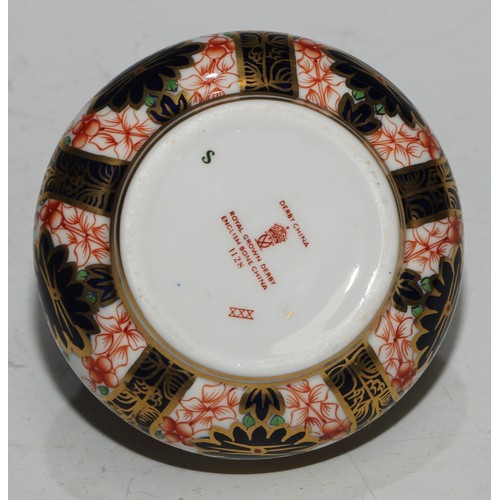 617 - A Royal Crown Derby 1128 pattern table cigarette lighter, 8.5cm diam, printed mark; another; a pair ... 