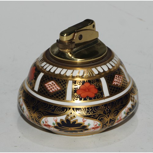 617 - A Royal Crown Derby 1128 pattern table cigarette lighter, 8.5cm diam, printed mark; another; a pair ... 