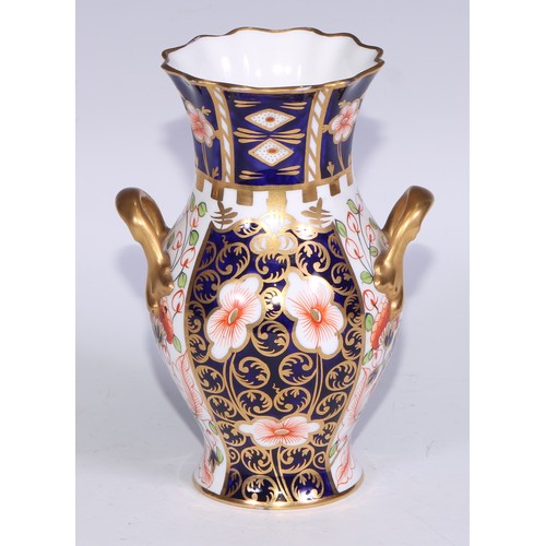 621 - A Royal Crown Derby 6299 pattern Imari fluted ovoid vase, 15cm high, printed mark; vases, similar (3... 