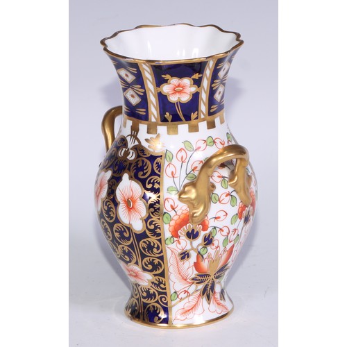 621 - A Royal Crown Derby 6299 pattern Imari fluted ovoid vase, 15cm high, printed mark; vases, similar (3... 