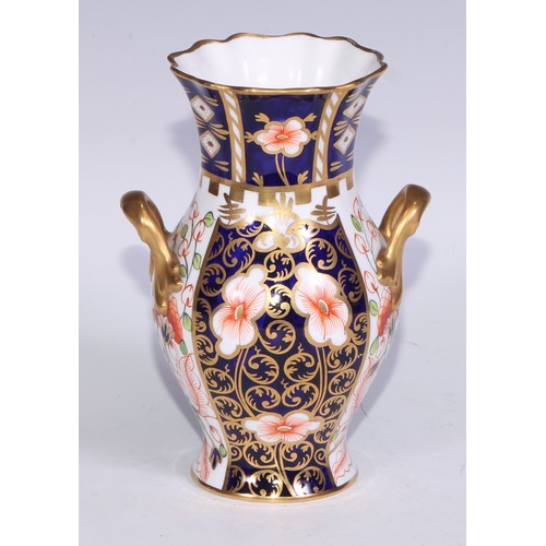 621 - A Royal Crown Derby 6299 pattern Imari fluted ovoid vase, 15cm high, printed mark; vases, similar (3... 