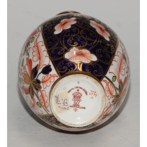 621 - A Royal Crown Derby 6299 pattern Imari fluted ovoid vase, 15cm high, printed mark; vases, similar (3... 