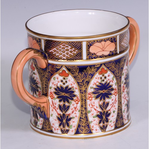 596 - A large Derby Crown Porcelain 1128 pattern two handled loving cup, peach scroll handles, 14cm high, ... 