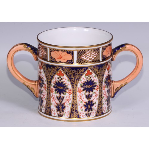 596 - A large Derby Crown Porcelain 1128 pattern two handled loving cup, peach scroll handles, 14cm high, ... 