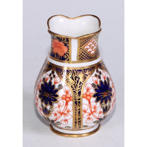 609 - A Royal Crown Derby 1128 Imari miniature ovoid vase, 8cm high, printed mark; an atomizer; etc. (5)