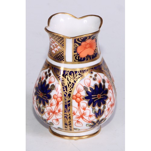 609 - A Royal Crown Derby 1128 Imari miniature ovoid vase, 8cm high, printed mark; an atomizer; etc. (5)