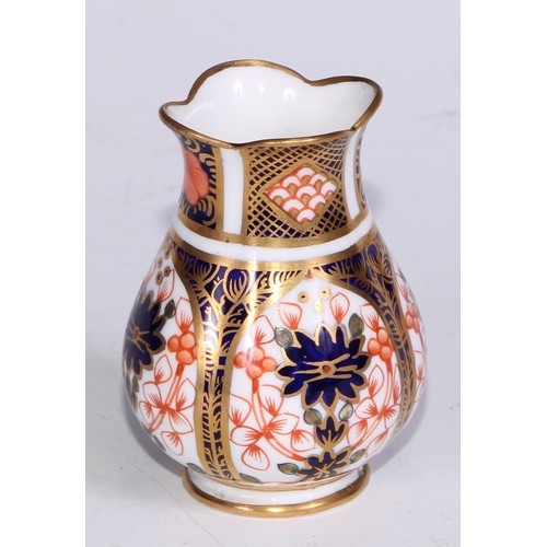 609 - A Royal Crown Derby 1128 Imari miniature ovoid vase, 8cm high, printed mark; an atomizer; etc. (5)