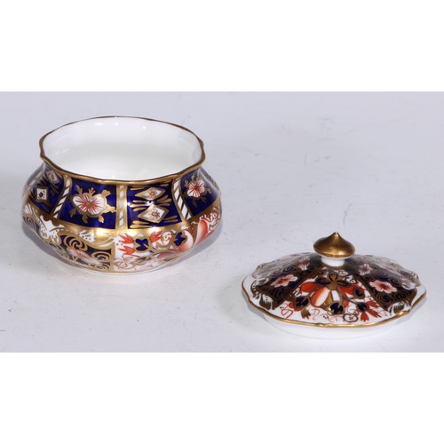 610 - A Royal Crown Derby 1128 Imari pattern miniature teacup and saucer, the saucer 7cm diam, printed mar... 