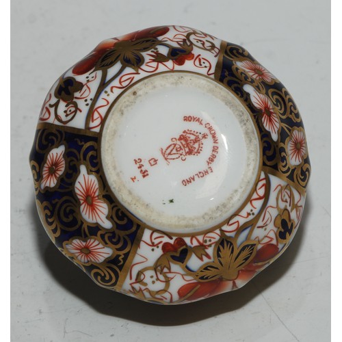 610 - A Royal Crown Derby 1128 Imari pattern miniature teacup and saucer, the saucer 7cm diam, printed mar... 