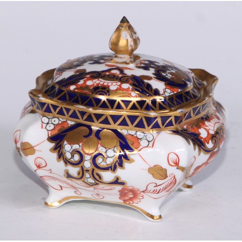 605 - A pair of Royal Crown Derby Imari square bombe shaped boxes and covers, 8cm wide, printed marks; ano... 