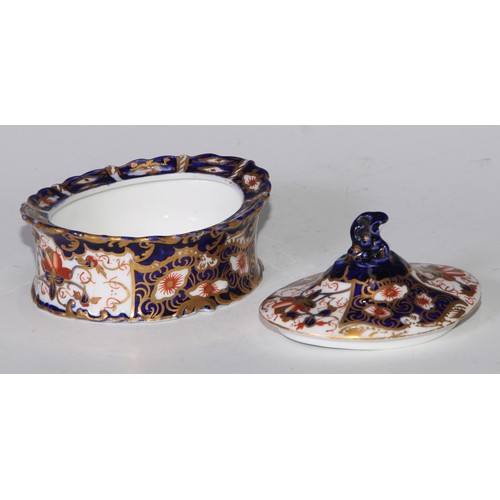 605 - A pair of Royal Crown Derby Imari square bombe shaped boxes and covers, 8cm wide, printed marks; ano... 