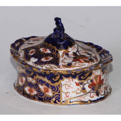 605 - A pair of Royal Crown Derby Imari square bombe shaped boxes and covers, 8cm wide, printed marks; ano... 