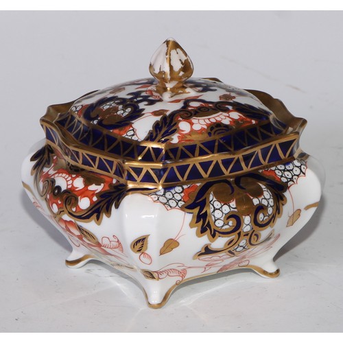 605 - A pair of Royal Crown Derby Imari square bombe shaped boxes and covers, 8cm wide, printed marks; ano... 