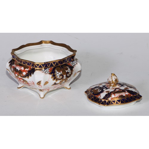 605 - A pair of Royal Crown Derby Imari square bombe shaped boxes and covers, 8cm wide, printed marks; ano... 