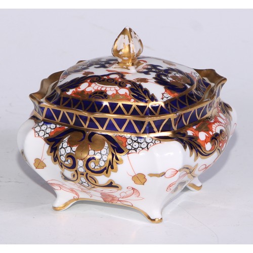 605 - A pair of Royal Crown Derby Imari square bombe shaped boxes and covers, 8cm wide, printed marks; ano... 