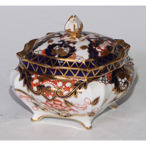 605 - A pair of Royal Crown Derby Imari square bombe shaped boxes and covers, 8cm wide, printed marks; ano... 