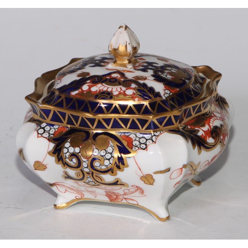 605 - A pair of Royal Crown Derby Imari square bombe shaped boxes and covers, 8cm wide, printed marks; ano... 