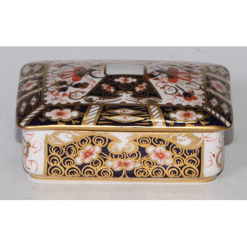 605 - A pair of Royal Crown Derby Imari square bombe shaped boxes and covers, 8cm wide, printed marks; ano... 