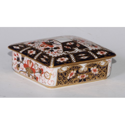 605 - A pair of Royal Crown Derby Imari square bombe shaped boxes and covers, 8cm wide, printed marks; ano... 